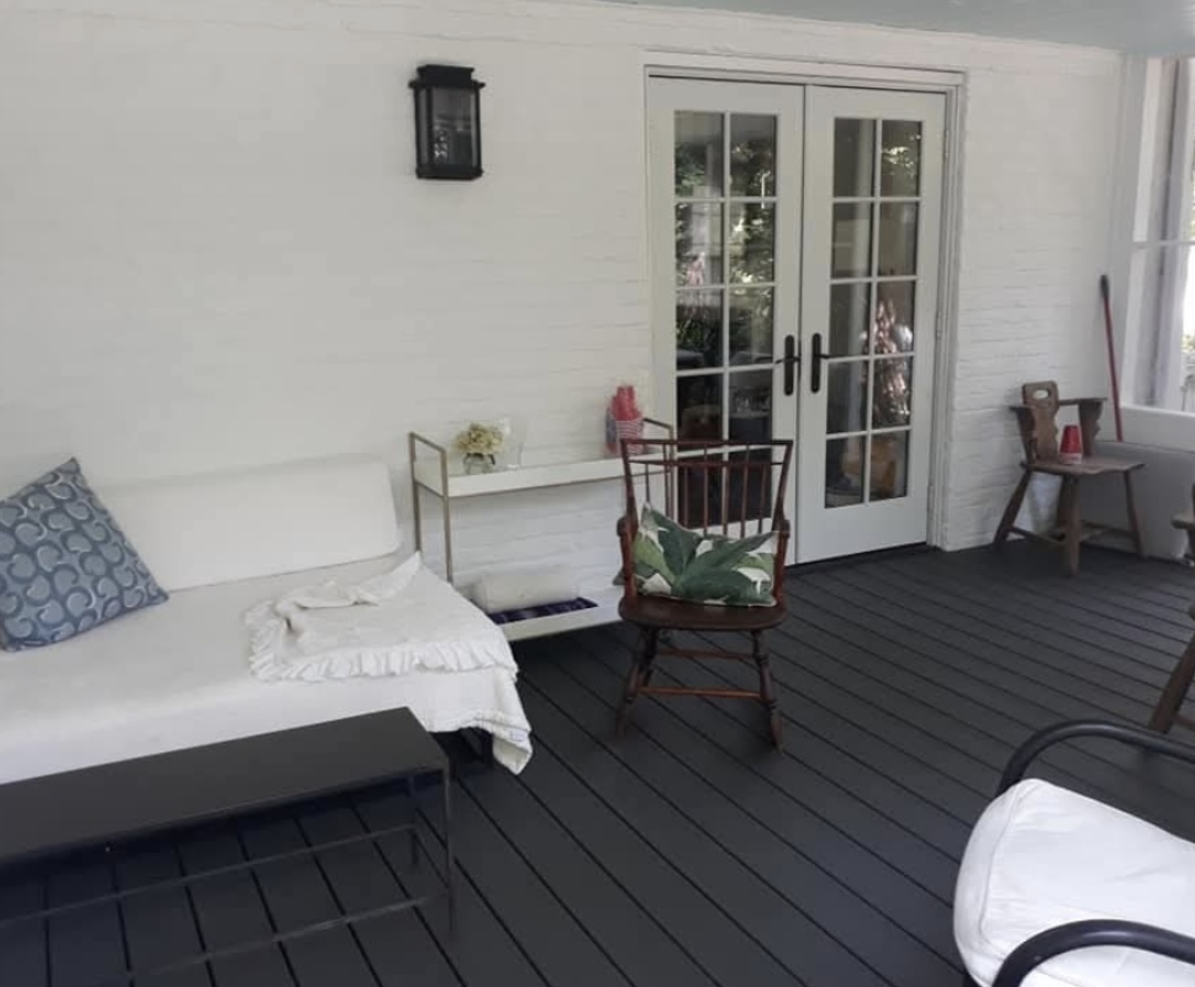 Finished screened porch furnished as an outdoor living space